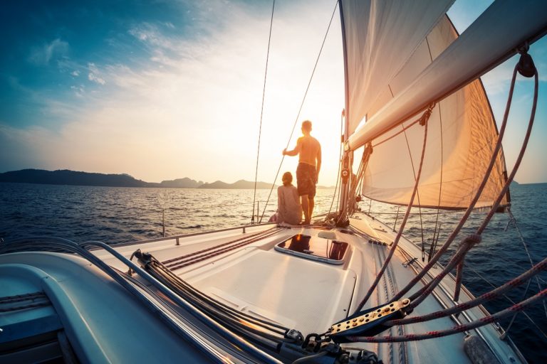 Couple sailing during sunset