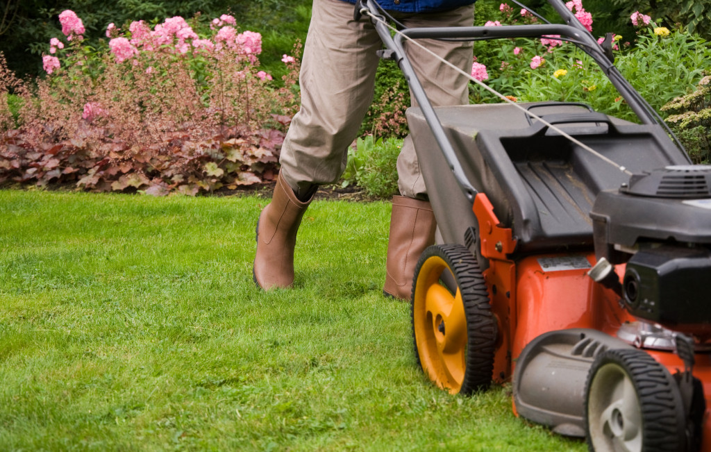 Gardener mowing the lawn