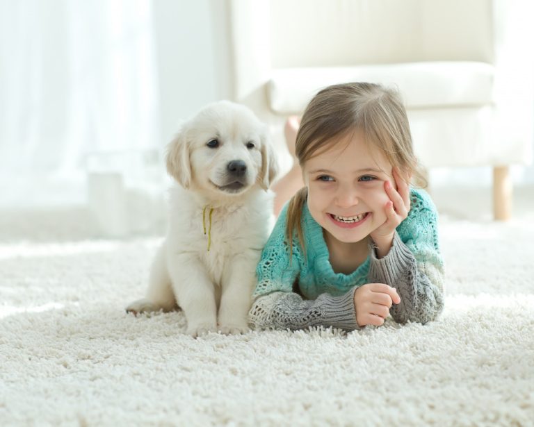 smiling little girl with her pet