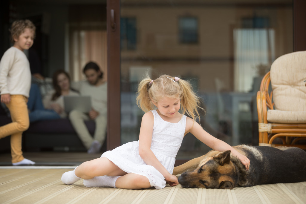 girl with her dog at the patio